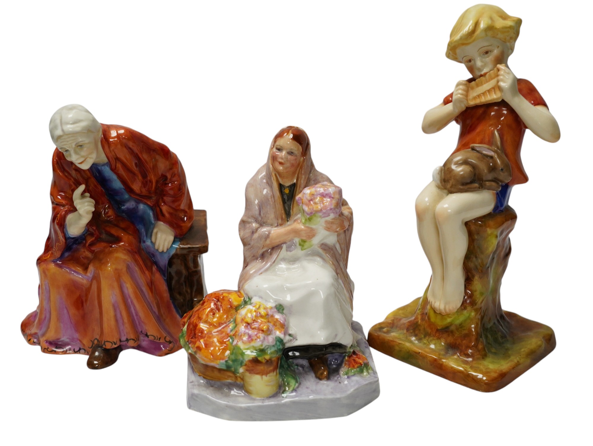 Three Worcester figurines comprising 'Dublin Flower Girl', The Fortune Teller and Peter Pan, tallest 20cm high. Condition - good